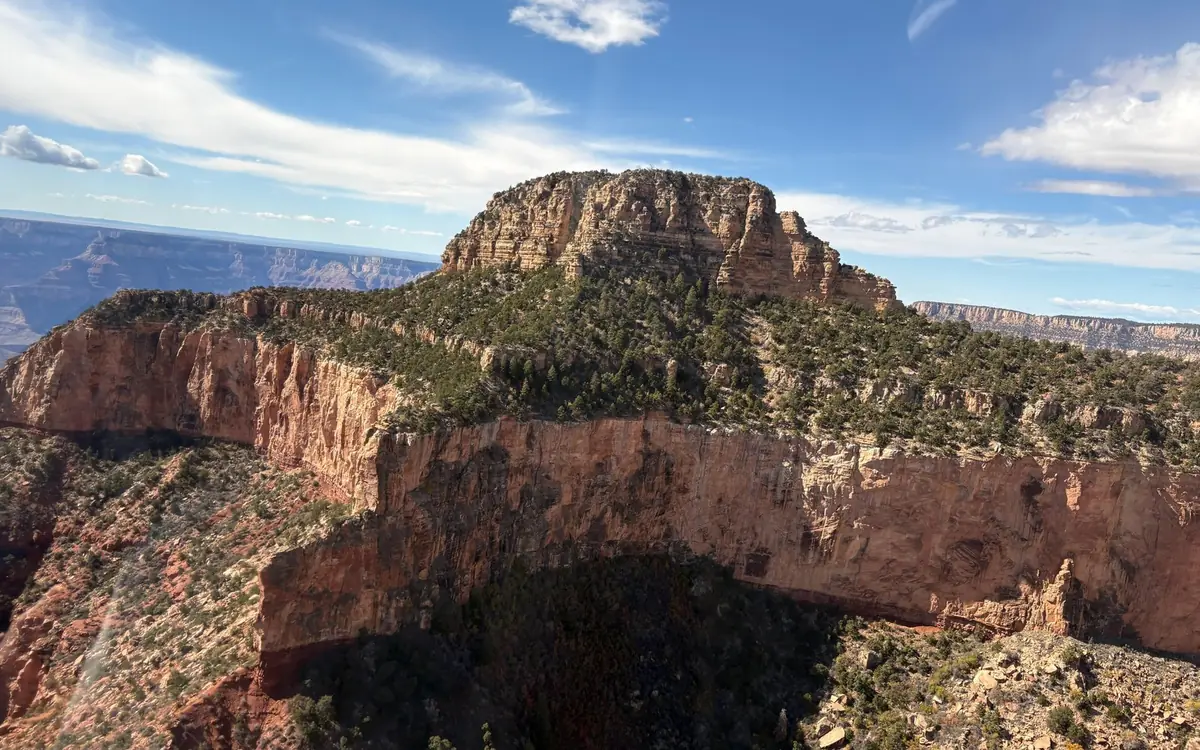 The layered walls of the Grand Canyon seen from a helicopter above the South Rim