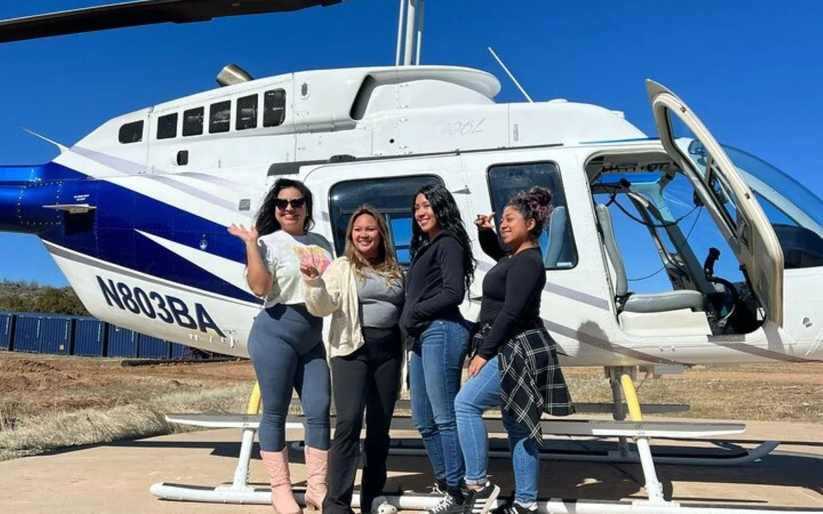 Passengers beside a helicopter before a Grand Canyon flight