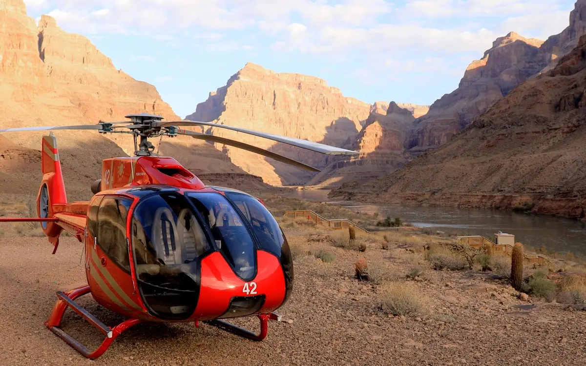 A helicopter on a landing site on the floor of the Grand Canyon